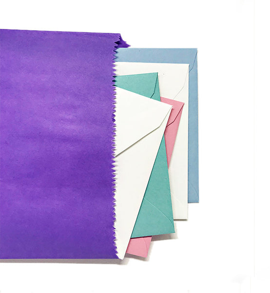 A selection of five greeting cards in envelopes, displayed in a fanned out arrangement.
